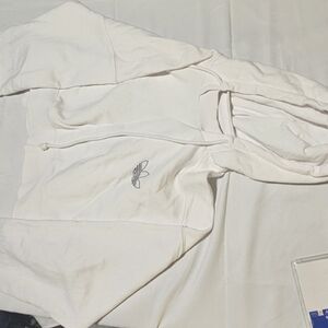 White pre-owned Adidas hoodie logo front and back.  Size medium